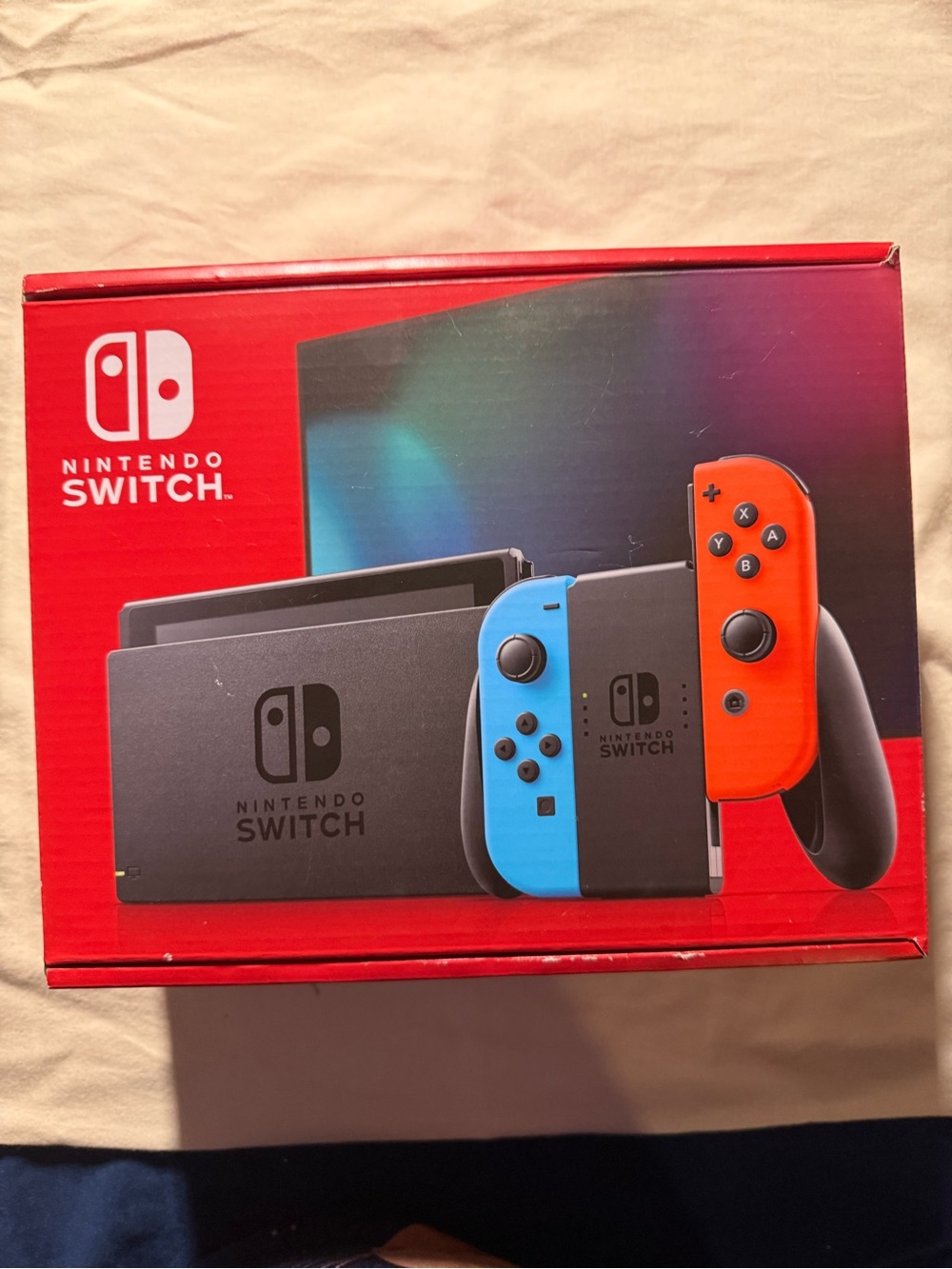 Nintendo Switch Console with Blue Left Joy-Con and Red Right Joy-Con